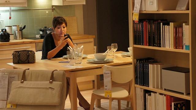 woman checking email on phone